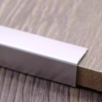 Stainless steel tile trim for marble edge