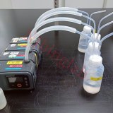 PFA gas washing bottle connected to air sampling pump
