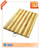 Wooden cutting board with active hanger