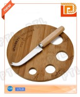 Wood-handled cheese knife with rounded bamboo cutting board