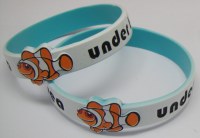 Spray coated silicone wristband with embossed goldfish printing